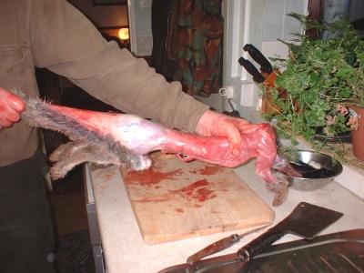 Removing skin from hind quarters - 22kg.